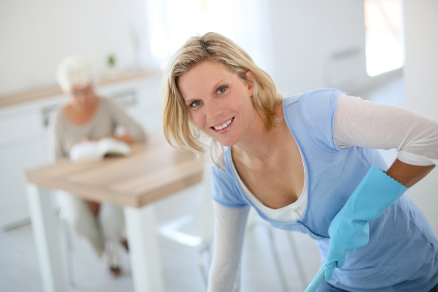 Homemaker assisting with household tasks